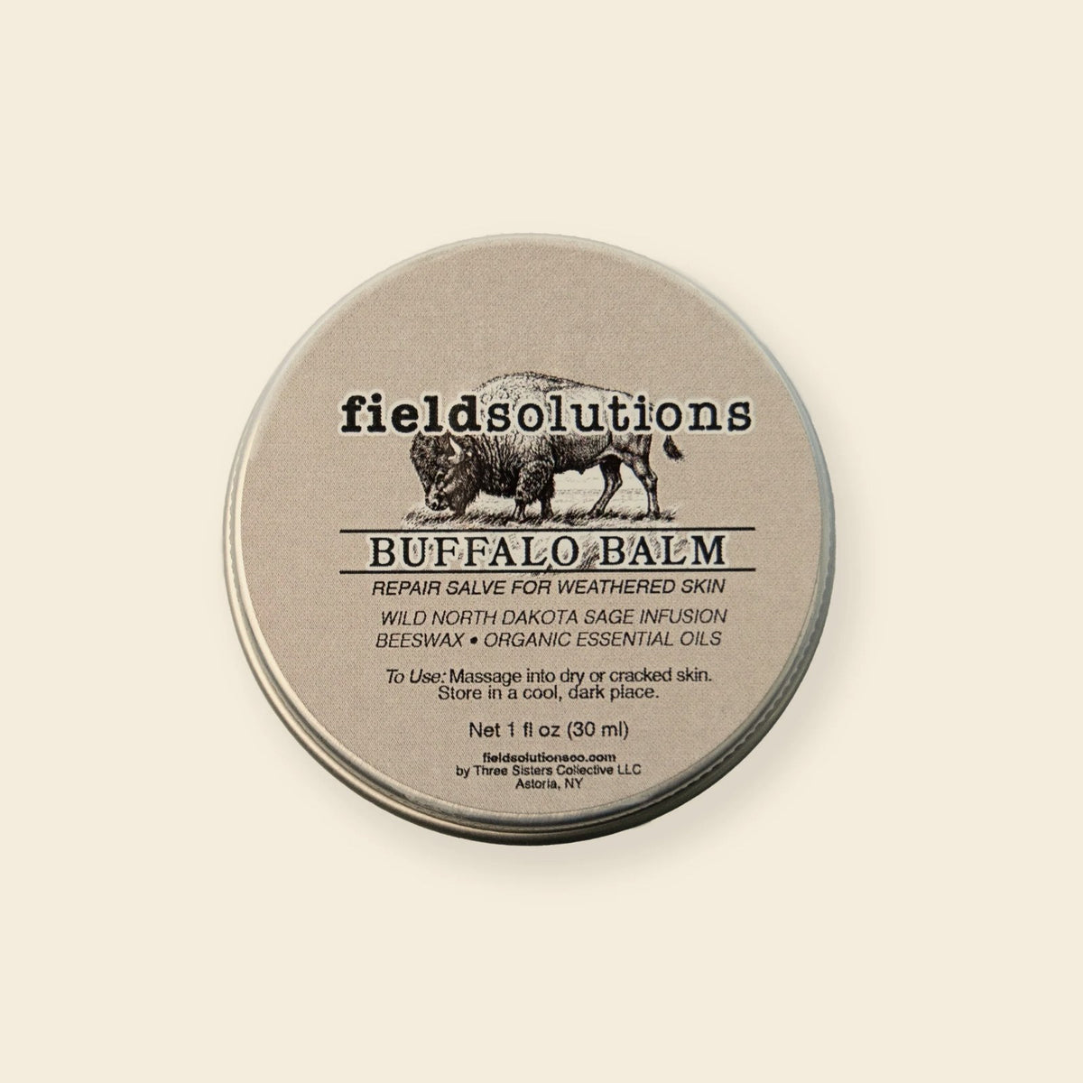 Buffalo Balm wild prairie sage salve in a round tin on a cream background